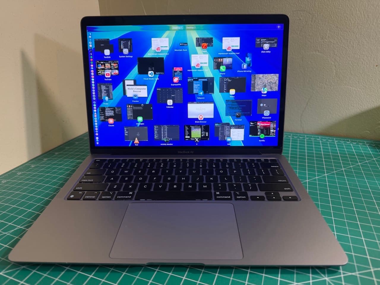 Mission Control on Nick's M1 MacBook Air — his full working toolkit open at once