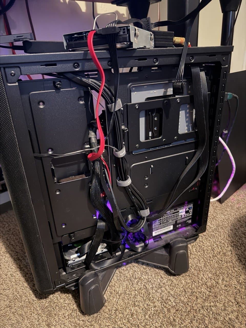 A failing hard drive sitting on top of the bench workstation, cabled straight to SATA