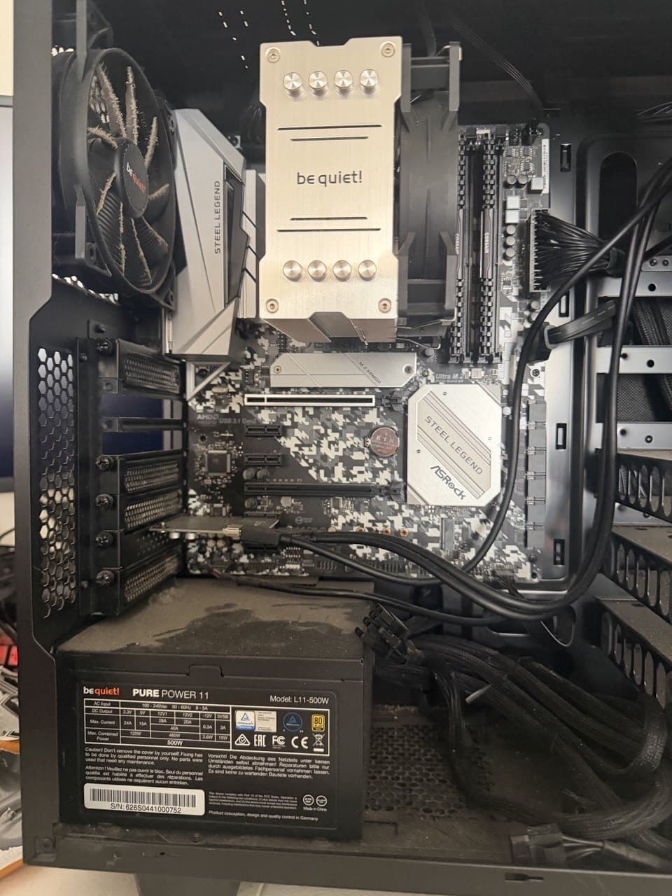 Inside a clean custom PC build — CPU cooler, motherboard, RAM, and power supply