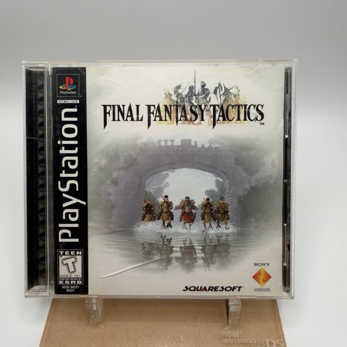 Final Fantasy Tactics PS1 black label game case on a stand